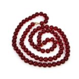 A CHERRY AMBER BEAD NECKLACE