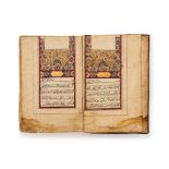 A LARGE ILLUMINATED QAJAR QURAN, SIGNED BY ABDULLAH BIN HUSSEIN DATED 1275/AH