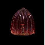 A FATIMID CARVED RED ROCK CRYSTAL CHESS PIECE, 9TH/10TH CENTURY, EGYPT