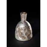 A WHEEL CUT GLASS BOTTLE, ABBASID, CIRCA 9TH CENTURY