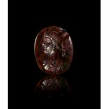 A ROMAN BLOODSTONE INTAGLIO OF A MAN DEPICTED AS SERAPIS, 2ND CENTURY A.D.