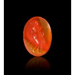 A ROMAN CARNELIAN INTAGLIO DEPICTING DEMETER CARRYING WHEAT, CIRCA 3RD CENTURY A.D.