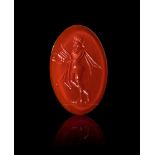 A ROMAN CARNELIAN INTAGLIO OF A STANDING MAN PLAYING THE LYRE, CIRCA 2ND CENTURY A.D.