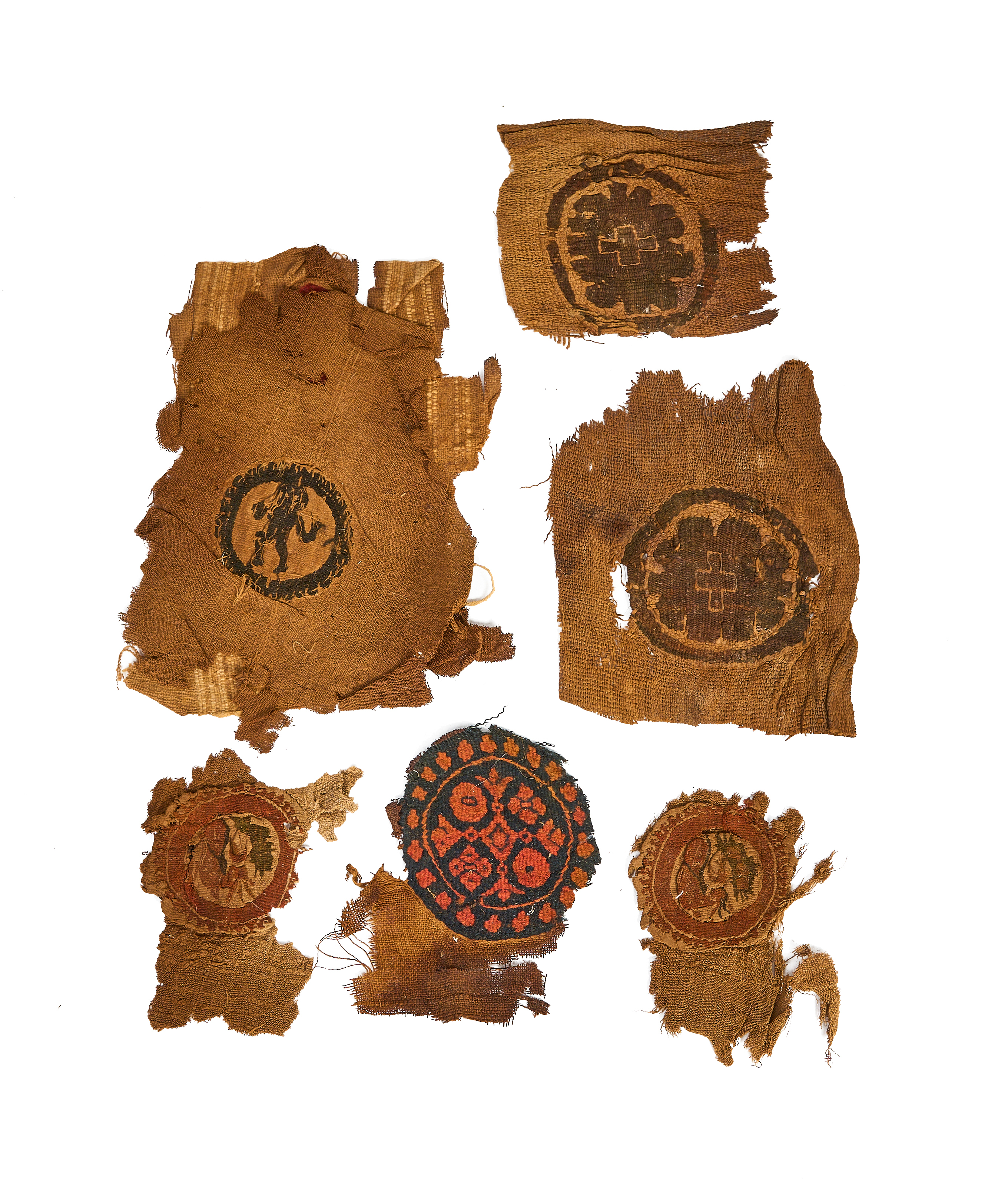 SIX COPTIC WOOL AND LINEN TEXTILE FRAGMENTS CIRCA 5TH-9TH CENTURY A.D.