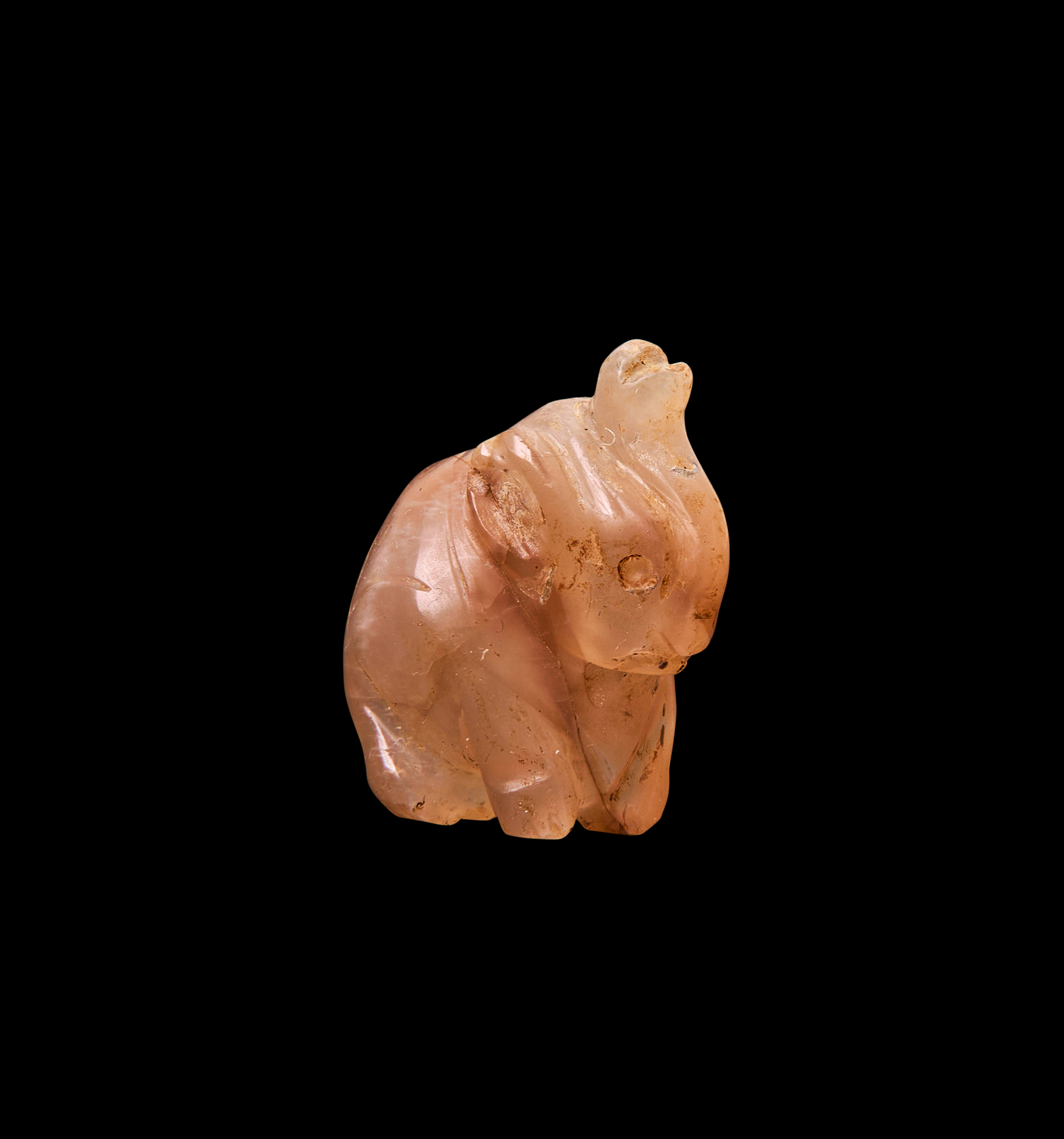 AN EGYPTIAN QUARTZ ELEPHANT AMULET, THIRD INTERMEDIATE PERIOD-ROMAN PERIOD, CIRCA 1ST MILLENNIUM B.