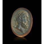 A ROMAN INTAGLIO WITH HEAD OF HERCULES CIRCA 2ND-3RD CENTURY A.D.