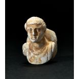 A ROMAN MARBLE FRAGMENT OF A BOY, CIRCA 2ND CENTURY A.D.