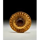 A GOLD DISC BROOCH FITTED WITH AN EYE AGATE "DZI" BEAD, EASTERN ROMAN, CIRCA 3RD CENTURY
