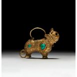 A FATIMID GOLD EARRING IN THE FORM OF A LION, CIRCA 10TH CENTURY, EGYPT