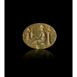 A GREEN JASPER INTAGLIO OF A RULER AND HIS ATTENDANTS, ROMAN IMPERIAL PERIOD, CIRCA 1ST CENTURY A.D.