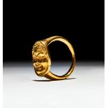 A ROMAN SOLID GOLD RING WITH A FACE DEPICITING A PAN SATYR, CIRCA 1ST-2ND CENTURY A.D.