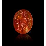 A ROMAN CARNELIAN INTAGLIO DEPICTING AN EMPEROR & A DEITY, REPUBLICAN PERIOD, CIRCA 1ST CENTURY B.C.