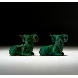 TWO LURISTAN BRONZE RECUMBENT BULLS, CIRCA 9TH-7TH CENTURY