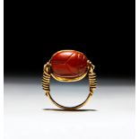 AN EAST GREEK GOLD AND CARNELIAN SCARAB FINGER RING ARCHAIC PERIOD, CIRCA LATE 6TH CENTURY B.C.