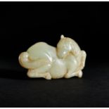 A CHINESE JADE BELT HOOK OF A RECUMBENT HORSE, QING DYNASTY (1644-1911)
