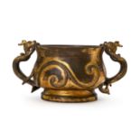 A PARCEL-GILT BRONZE 'MYTHICAL BEASTS' DRAGON-HANDLED CENSER MING DYNASTY, 16TH CENTURY