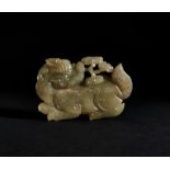A CHINESE JADE PLAQUE IN THE FORM OF A MYTHICAL BEAST, QING DYNASTY (1644-1911)