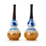 A PAIR OF CHINESE BLUE & WHITE CAFE AU LAIT DOUBLE GUORD WATER SPRINKLERS, KANGXI PERIOD (1622-1722)