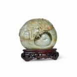 A CHINESE CARVED JADE FIGURE OF A DUCK IN A NEST, QING DYNASTY (1644-1911)