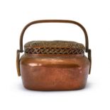 A CHINESE ENGRAVED COPPER HAND WARMER, QING DYNASTY (1644-1911)