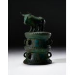 A LURISTAN BRONZE BULL ON TOP OF A COWRY CONTAINER, CIRCA 2ND MILLENNIUM B.C.