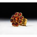 A GOTHIC/BYZANTINE GOLD & GARNET RING, CIRCA 5TH-7TH CENTURY A.D.