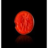 A ROMAN CARNELIAN INTAGLIO OF A FARMER YIELDING CROPS, CIRCA 1ST-2ND CENTURY A.D.