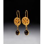 A PAIR OF ROMAN GOLD MEDALLION AND GARNET EARRINGS CIRCA 2ND-3RD CENTURY A.D.