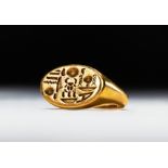AN EGYPTIAN GOLD SIGNET RING