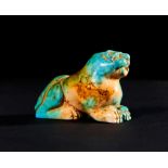 A RARE TURQUOISE ACHAEMENID SEATED LEOPARD AMULET FIRST HALF OF 5TH CENTURY B.C