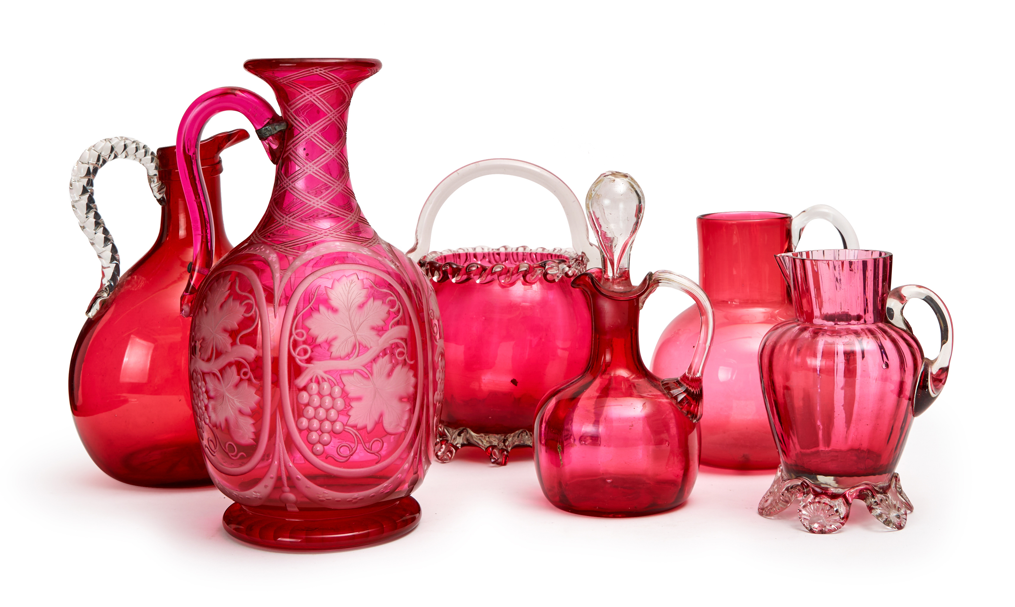 ASSORTMENT OF CRANBERRY GLASS OBJECTS, COMPROMISING EWERS & A BASKET