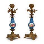 A PAIR OF FRENCH PORCELAIN BRONZE MOUNTED CANDLESTICKS, PROBABLY SEVRES