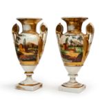 A PAIR OF NEOCLASSICAL STYLE PAINTED AND PARCEL GILT PORCELAIN VASES