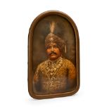 A FRAMED PAINTING OF A MAHARAJA