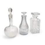 THREE CUT CRYSTAL GLASS DECANTERS