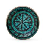 A TURQUOISE BLACK SLIP DECORATED POTTERY BOWL, KASHAN, 12TH CENTURY, PERSIA