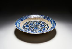 A LARGE 'KUBACHI' POTTERY DISH SAFAVID NORTH WEST IRAN, EARLY 17TH CENTURY