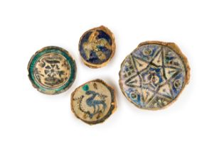 FOUR FATIMID & MAMLUK POTTERY FRAGMENTS, 10TH-14TH CENTURY