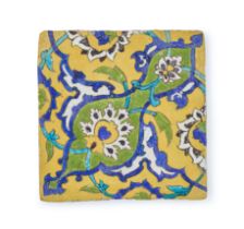 A FINE SAFAVID YELLOW GLAZED QUARDA SECA TILE, 17TH CENTURY, PERSIA