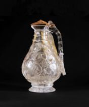 A CARVED ROCK CRYSTAL EWER WITH GOLD MOUNTS