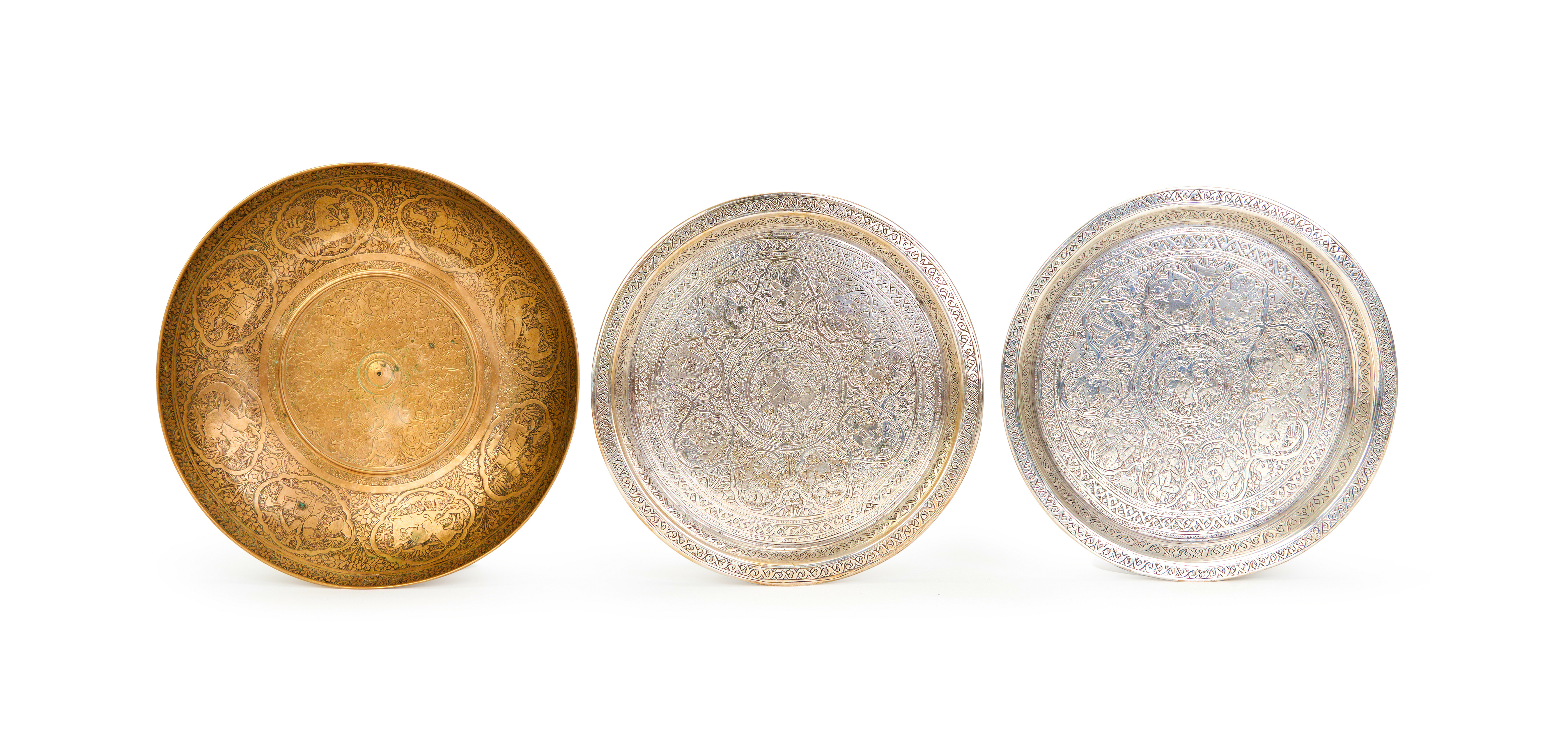 A HAND CHASED PERSIAN QAJAR BRASS DISH WITH A PAIR OF SILVERED BRASS DISHES, 19TH CENTURY