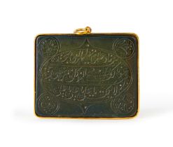 A CALLIGRAPHIC INSCRIBED SPINACH JADE AMULET SET ON GOLD, 19TH CENTURY, PERSIA