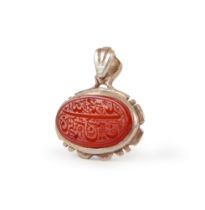 A CALLIGRAPHIC INSCRIBED AGATE PENDANT, 19TH CENTURY OR LATER, PERSIA