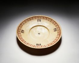 A LARGE INSCRIBED NISHAPUR POTTERY DISH, CIRCA 10TH CENTURY