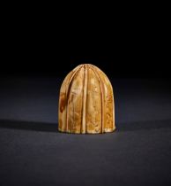 A CARVED GAMING PIECE, FATIMID, EGYPT 9TH-10TH CENTURY