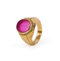 A CALLIGRAPHIC INSCRIBED RUBY SEAL SET ON A PROBABLY GOLD RING, 19TH CENTURY AND LATER