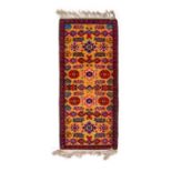 A SMALL RUNNER RUG, PROBABLY RUSSIAN