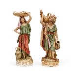 A PAIR OF ROYAL DUX PORCELAIN FIGURES OF AN EASTERN WATER BEARER & HIS COMPANION