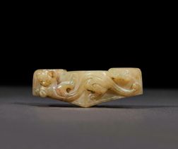 A YELLOW JADE SWORD GUARD, HAN DYNASTY OR LATER