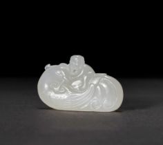 A WHITE JADE CARVING OF AN ASPARA, QING DYNASTY (1644-1911)